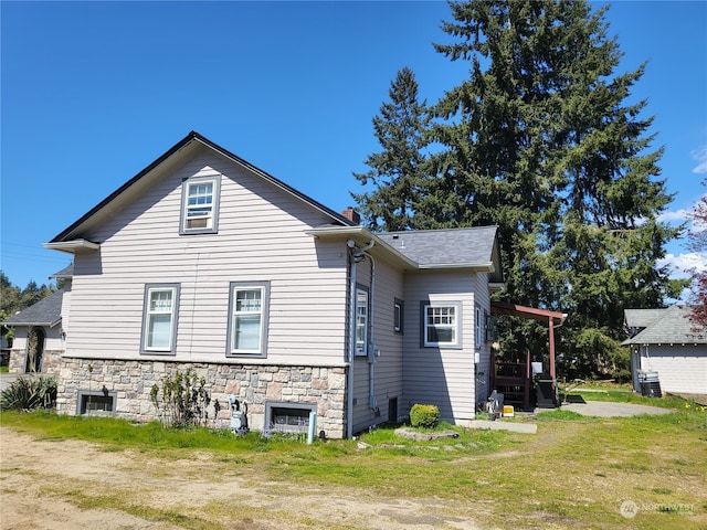 view of home's exterior featuring a yard