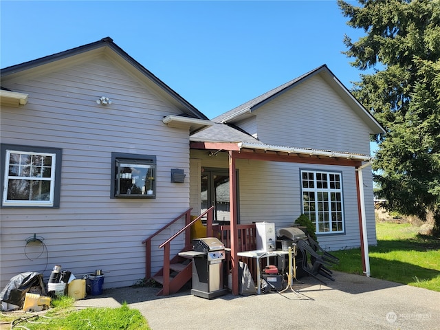 rear view of property with a patio area