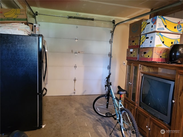 garage featuring black fridge