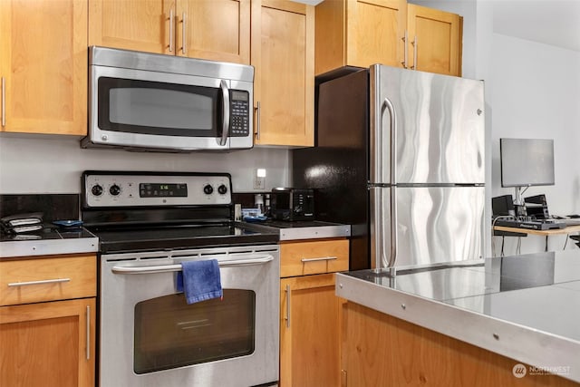 kitchen with appliances with stainless steel finishes