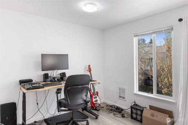 office space with hardwood / wood-style flooring