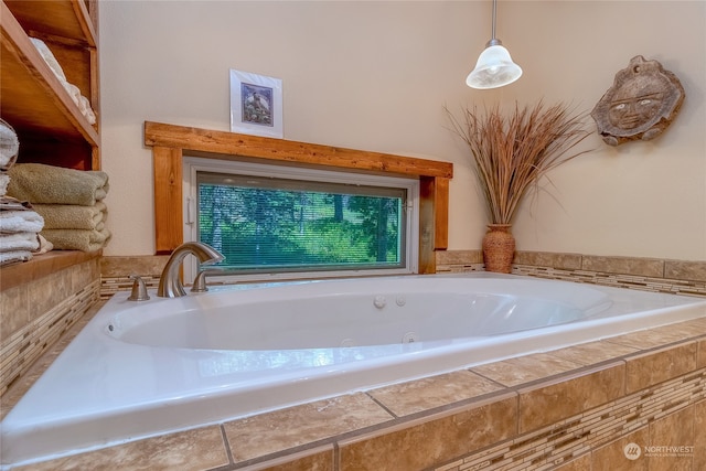 bathroom featuring a relaxing tiled bath