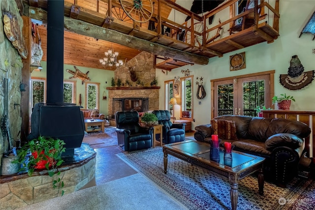 living room featuring high vaulted ceiling, plenty of natural light, french doors, and a notable chandelier