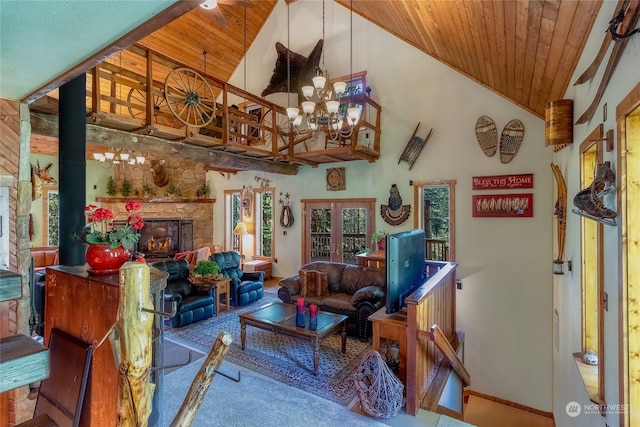 carpeted living room with high vaulted ceiling, french doors, an inviting chandelier, wood ceiling, and a stone fireplace