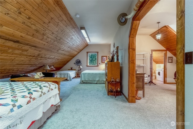 carpeted bedroom with wooden ceiling, vaulted ceiling, and washer / dryer