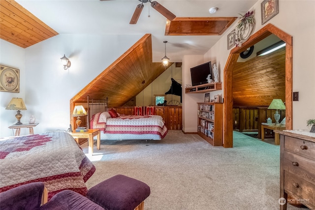 carpeted bedroom with wooden walls, wooden ceiling, ceiling fan, and vaulted ceiling