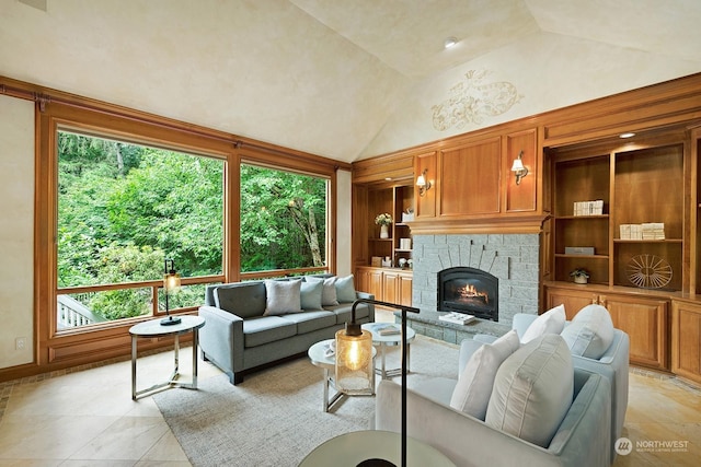 living room with a stone fireplace, high vaulted ceiling, and built in shelves