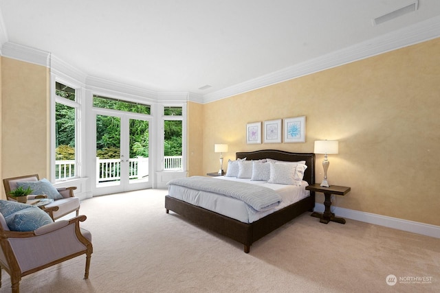 bedroom with crown molding, access to outside, and light colored carpet