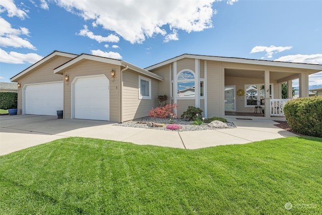 ranch-style home featuring a garage, a porch, and a front lawn