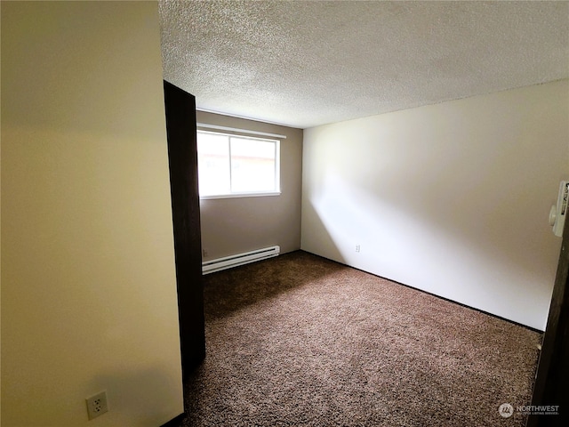 6114 Glen Mary Ln SE Unit A-D, Lacey, WA 98503 - spare room with a textured ceiling, dark carpet, and baseboard heating