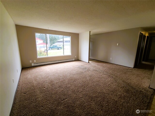 6114 Glen Mary Ln SE Unit A-D, Lacey, WA 98503 - unfurnished room featuring a textured ceiling, carpet floors, and baseboard heating
