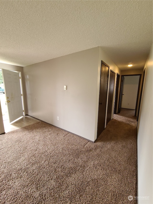 6114 Glen Mary Ln SE Unit A-D, Lacey, WA 98503 - unfurnished room featuring a textured ceiling and carpet floors