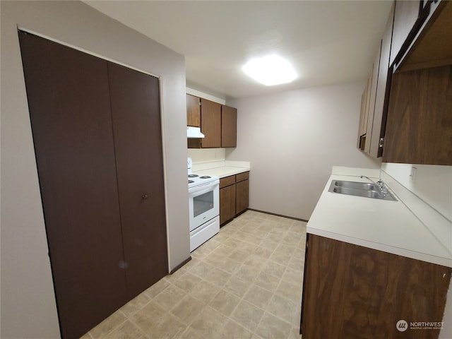 6114 Glen Mary Ln SE Unit A-D, Lacey, WA 98503 - kitchen with dark brown cabinetry, sink, light tile floors, and electric stove