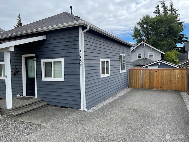 view of property exterior with a patio area