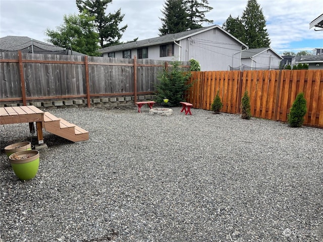 view of playground with a fire pit