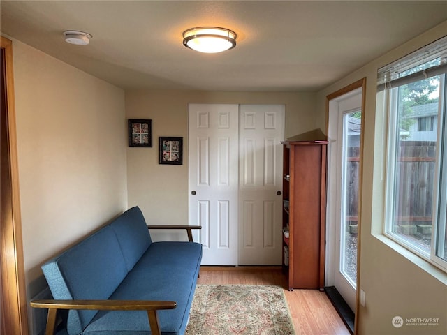 living area with light hardwood / wood-style flooring