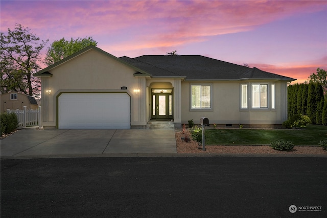 ranch-style home with a garage