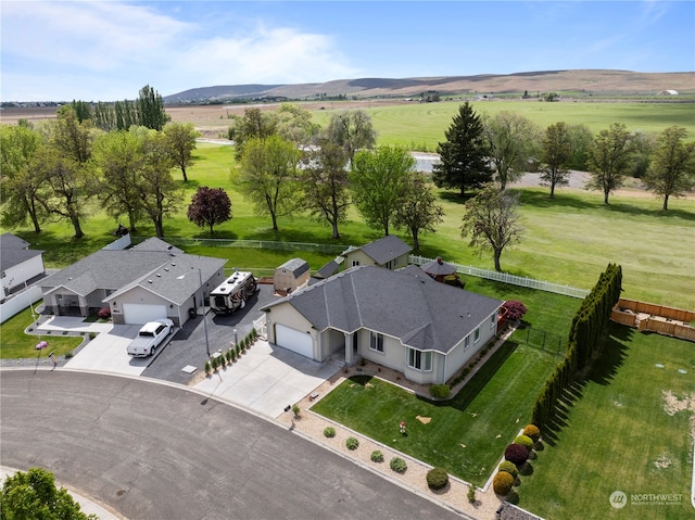 bird's eye view featuring a rural view and a mountain view