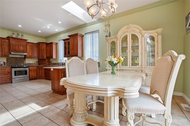 tiled dining area featuring ornamental molding and an inviting chandelier