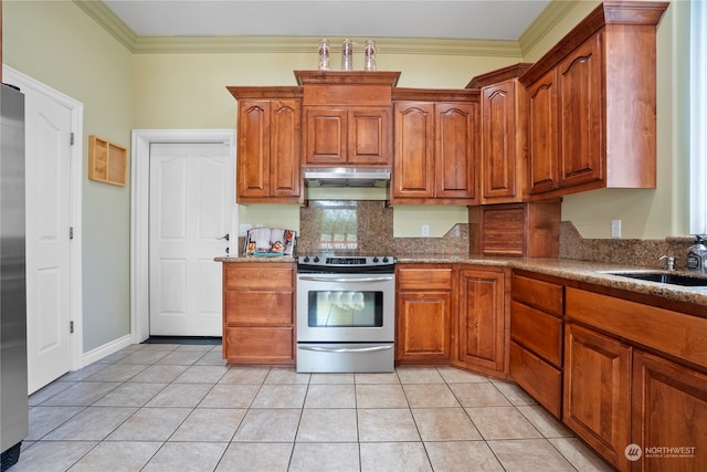 kitchen with stainless steel appliances, ornamental molding, and light tile patterned flooring