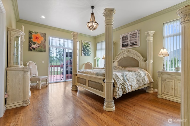 bedroom featuring ornamental molding, multiple windows, access to exterior, and wood-type flooring