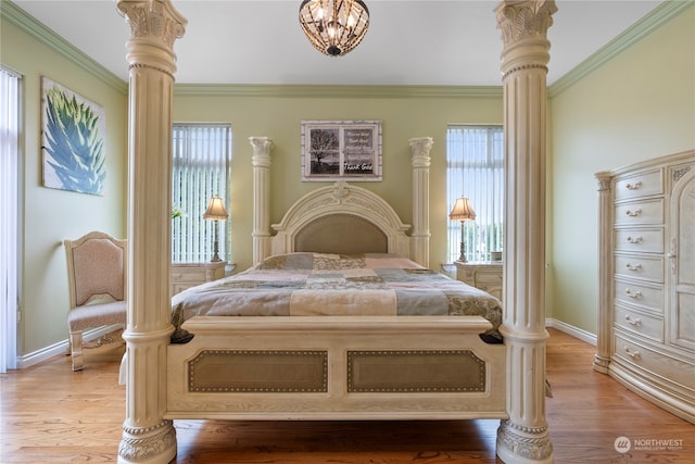 bedroom featuring ornamental molding and light hardwood / wood-style flooring