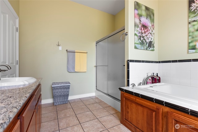 bathroom featuring vanity, independent shower and bath, and tile patterned floors