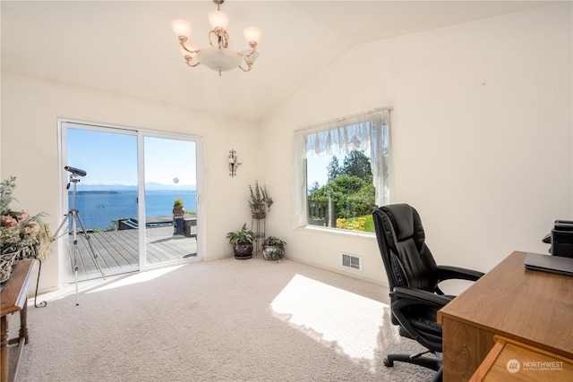 carpeted home office featuring lofted ceiling, a notable chandelier, and a water view