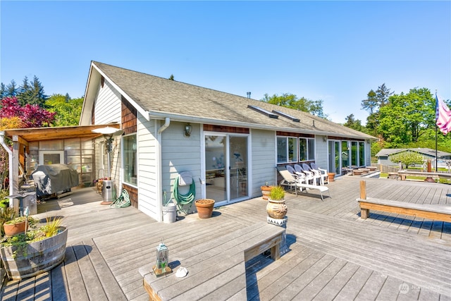 wooden deck with grilling area