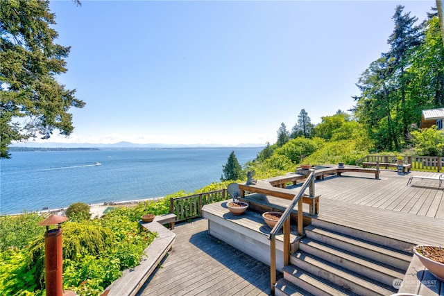 wooden deck featuring a water view