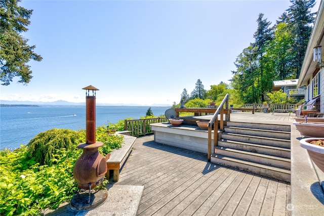 deck featuring a water view