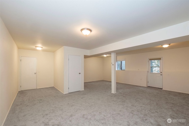 basement with light colored carpet