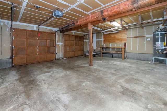 garage featuring water heater and a garage door opener