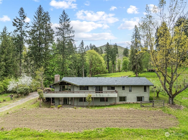 back of house featuring a deck