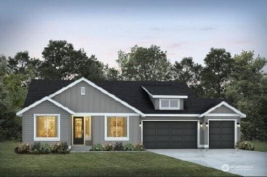 view of front facade featuring an attached garage, a front lawn, and concrete driveway