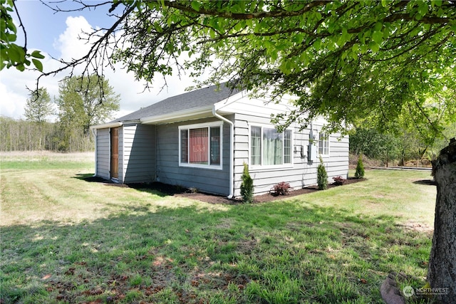 view of home's exterior featuring a lawn