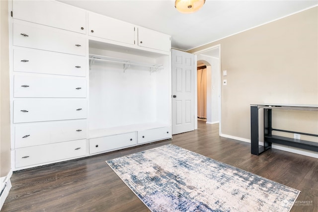 bedroom featuring dark hardwood / wood-style flooring and a closet