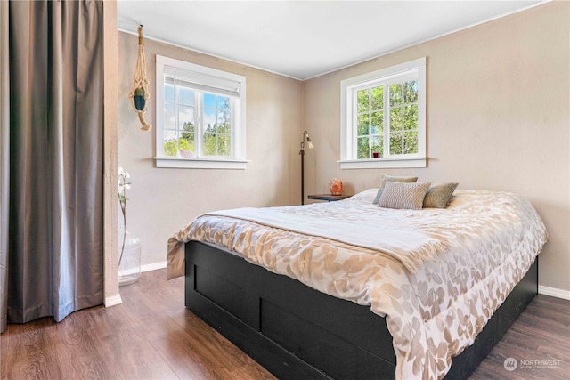 bedroom featuring dark hardwood / wood-style flooring