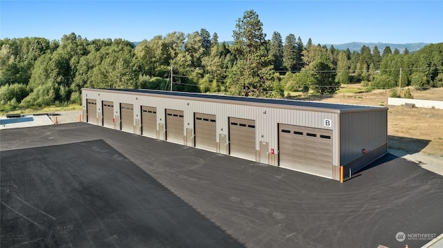 garage with a wooded view