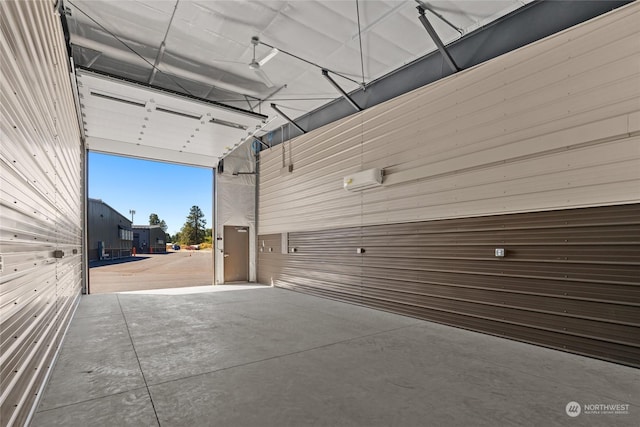 garage featuring an AC wall unit