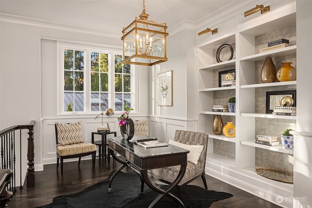 living area featuring crown molding, built in shelves, a chandelier, and dark wood-type flooring