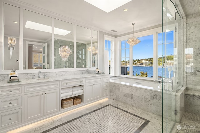 bathroom featuring tile flooring, double vanity, a water view, and independent shower and bath