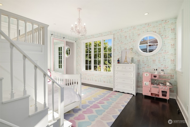 entryway featuring an inviting chandelier and dark hardwood / wood-style flooring