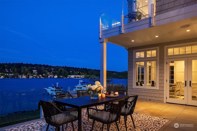 view of patio with french doors and a balcony