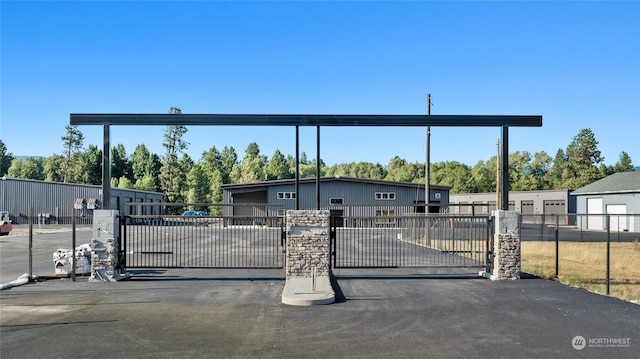 view of gate featuring fence