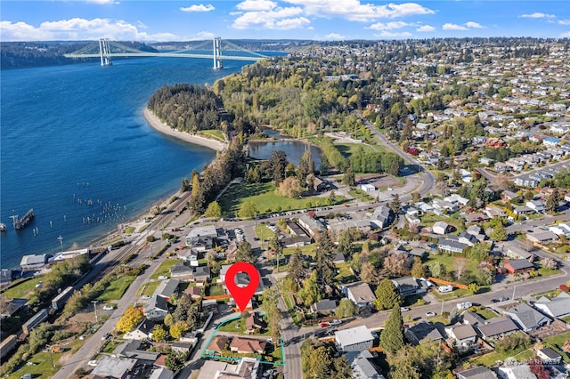 birds eye view of property featuring a water view