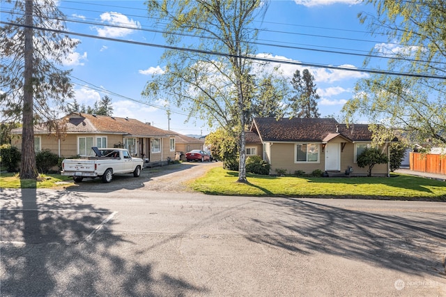 ranch-style home with a front yard