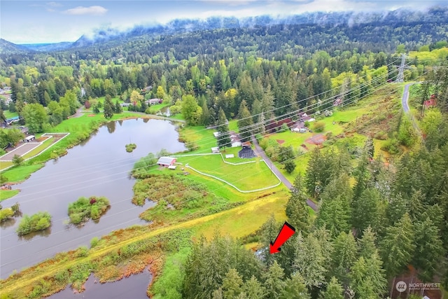 birds eye view of property with a water view