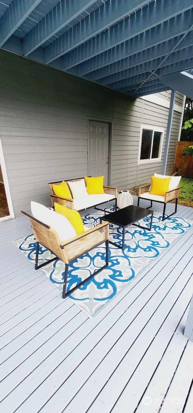 wooden deck with an outdoor hangout area