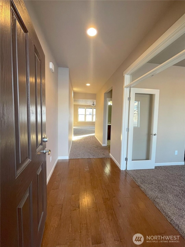 hall featuring wood-type flooring